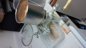 Grinding the toasted grains.